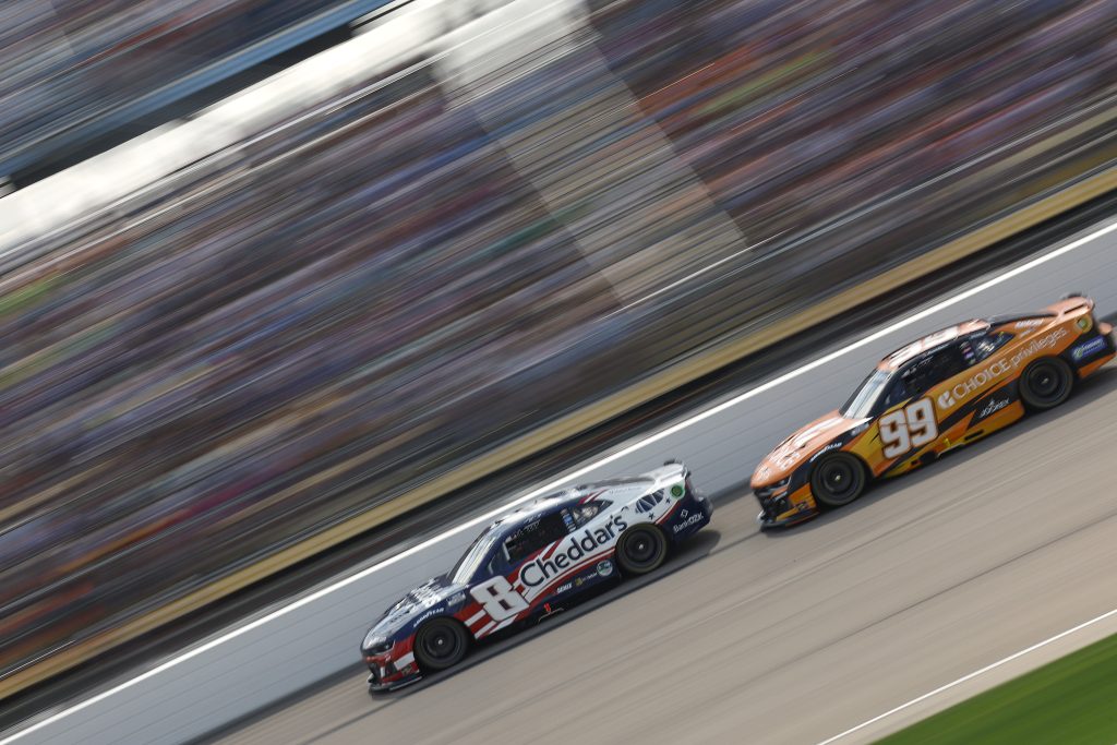 NEWTON, IOWA - AUGUST 03: Kyle Busch, driver of the #8 Cheddar's Scratch Kitchen Chevrolet, and Daniel Suarez, driver of the #99 Choice Privileges Chevrolet, race during the NASCAR Cup Series Iowa Corn 350 Powered by Ethanol at Iowa Speedway on August 03, 2025 in Newton, Iowa. (Photo by Sean Gardner/Getty Images) | Getty Images