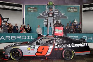 CONCORD, NORTH CAROLINA - MAY 23: Ross Chastain, driver of the #9 Carolina Carports Chevrolet, celebrates with smashing a watermelon in victory lane after winning the NASCAR O'Reilly Auto Parts Series Charbroil 300 at Charlotte Motor Speedway on May 23, 2026 in Concord, North Carolina. (Photo by Jonathan Bachman/Getty Images) | Getty Images