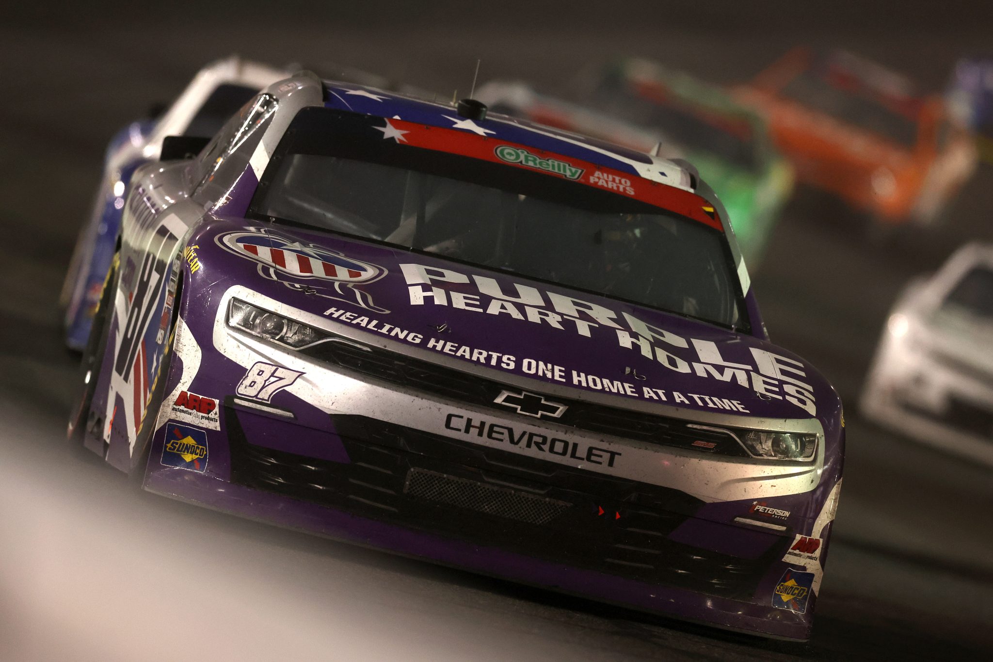 CONCORD, NORTH CAROLINA - MAY 23: Austin Green, driver of the #87 Purple Hearts and Homes Chevrolet, drives during the NASCAR O'Reilly Auto Parts Series Charbroil 300 at Charlotte Motor Speedway on May 23, 2026 in Concord, North Carolina. (Photo by David Jensen/Getty Images) | Getty Images