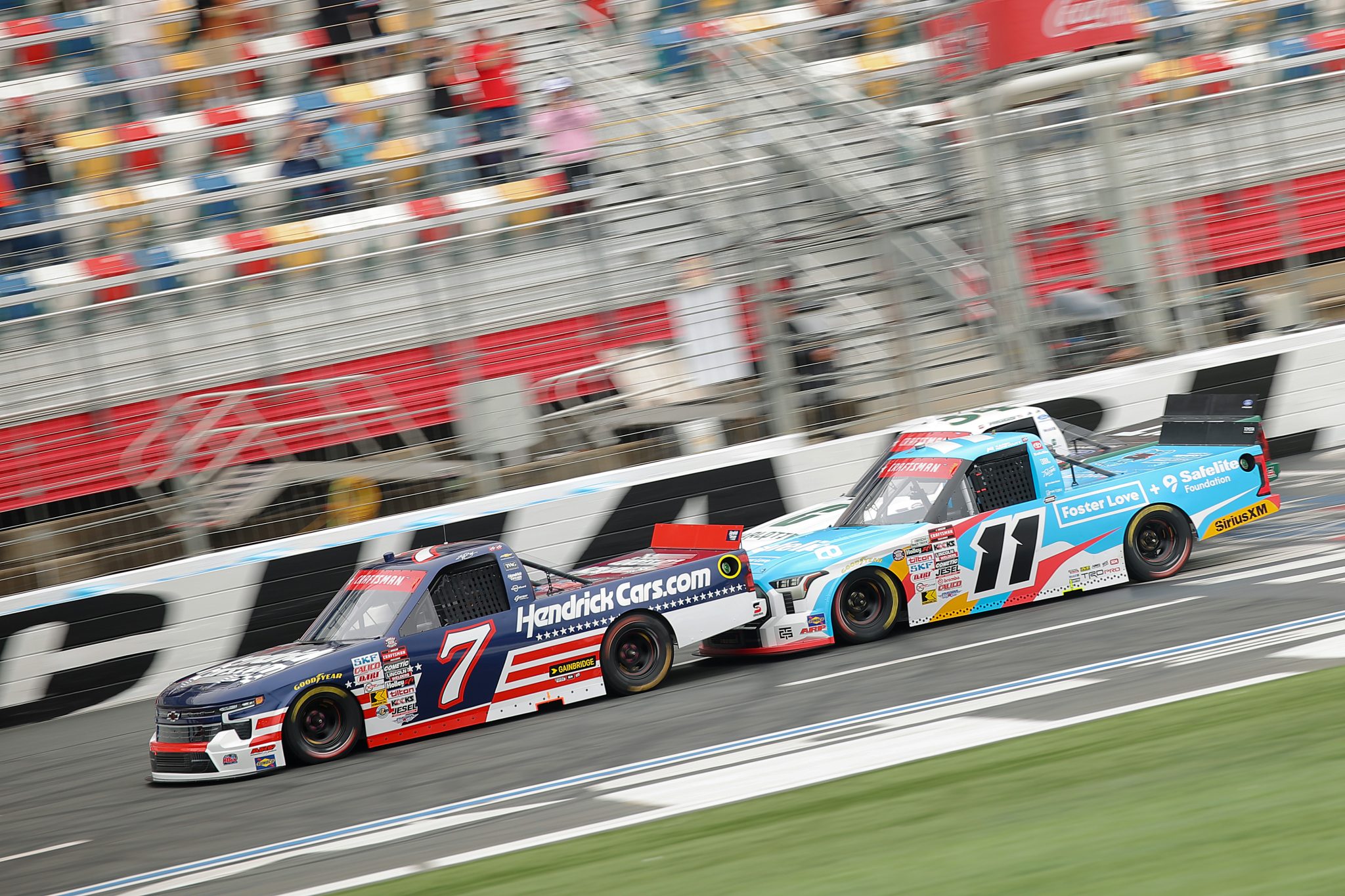 CONCORD, NORTH CAROLINA - MAY 24: Corey Day, driver of the #7 HendrickCars.com Chevrolet, and Kaden Honeycutt, driver of the #11 Safelite/Foster Love Toyota, race during the NASCAR Craftsman Truck Series North Carolina Education Lottery 200 at Charlotte Motor Speedway on May 24, 2026 in Concord, North Carolina. (Photo by Jonathan Bachman/Getty Images) | Getty Images