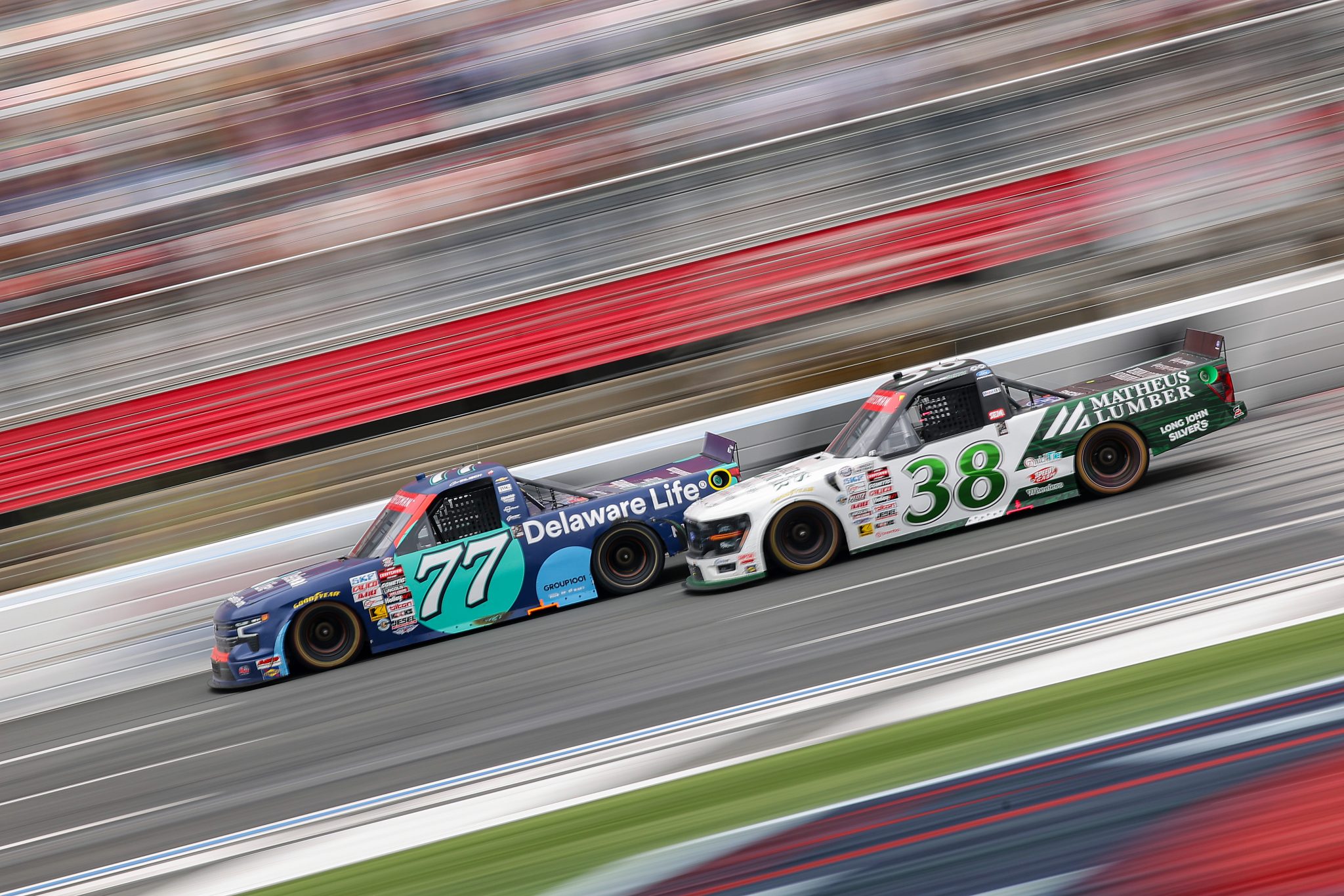 CONCORD, NORTH CAROLINA - MAY 24: Connor Zilisch, driver of the #77 Delaware Life Chevrolet, and Chandler Smith, driver of the #38 Matheus Lumber Ford, race during the NASCAR Craftsman Truck Series North Carolina Education Lottery 200 at Charlotte Motor Speedway on May 24, 2026 in Concord, North Carolina. (Photo by Jonathan Bachman/Getty Images) | Getty Images