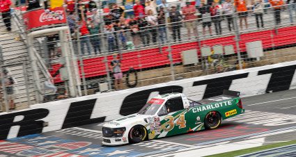 CONCORD, NORTH CAROLINA - MAY 24: Layne Riggs, driver of the #34 University of North Carolina at Charlotte Ford, takes the checkered flag under caution to win the NASCAR Craftsman Truck Series North Carolina Education Lottery 200 at Charlotte Motor Speedway on May 24, 2026 in Concord, North Carolina. (Photo by Jonathan Bachman/Getty Images) | Getty Images