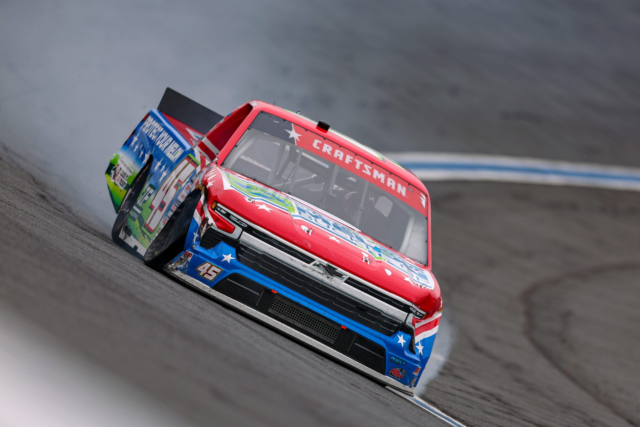 CONCORD, NORTH CAROLINA - MAY 24: Ross Chastain, driver of the #45 NC Governor's Hwy Safety Program Chevrolet, drives with a trail of smoke during the NASCAR Craftsman Truck Series North Carolina Education Lottery 200 at Charlotte Motor Speedway on May 24, 2026 in Concord, North Carolina. (Photo by David Jensen/Getty Images) | Getty Images