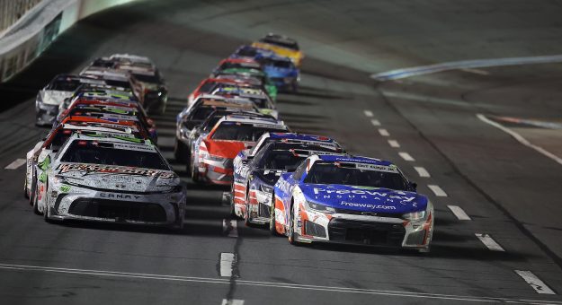 CONCORD, NORTH CAROLINA - MAY 24: Daniel Suarez, driver of the #7 Freeway Insurance Chevrolet, and Christopher Bell, driver of the #20 Interstate Batteries Toyota, leads the field during the NASCAR Cup Series Coca-Cola 600 at Charlotte Motor Speedway on May 24, 2026 in Concord, North Carolina. (Photo by Jonathan Bachman/Getty Images) | Getty Images