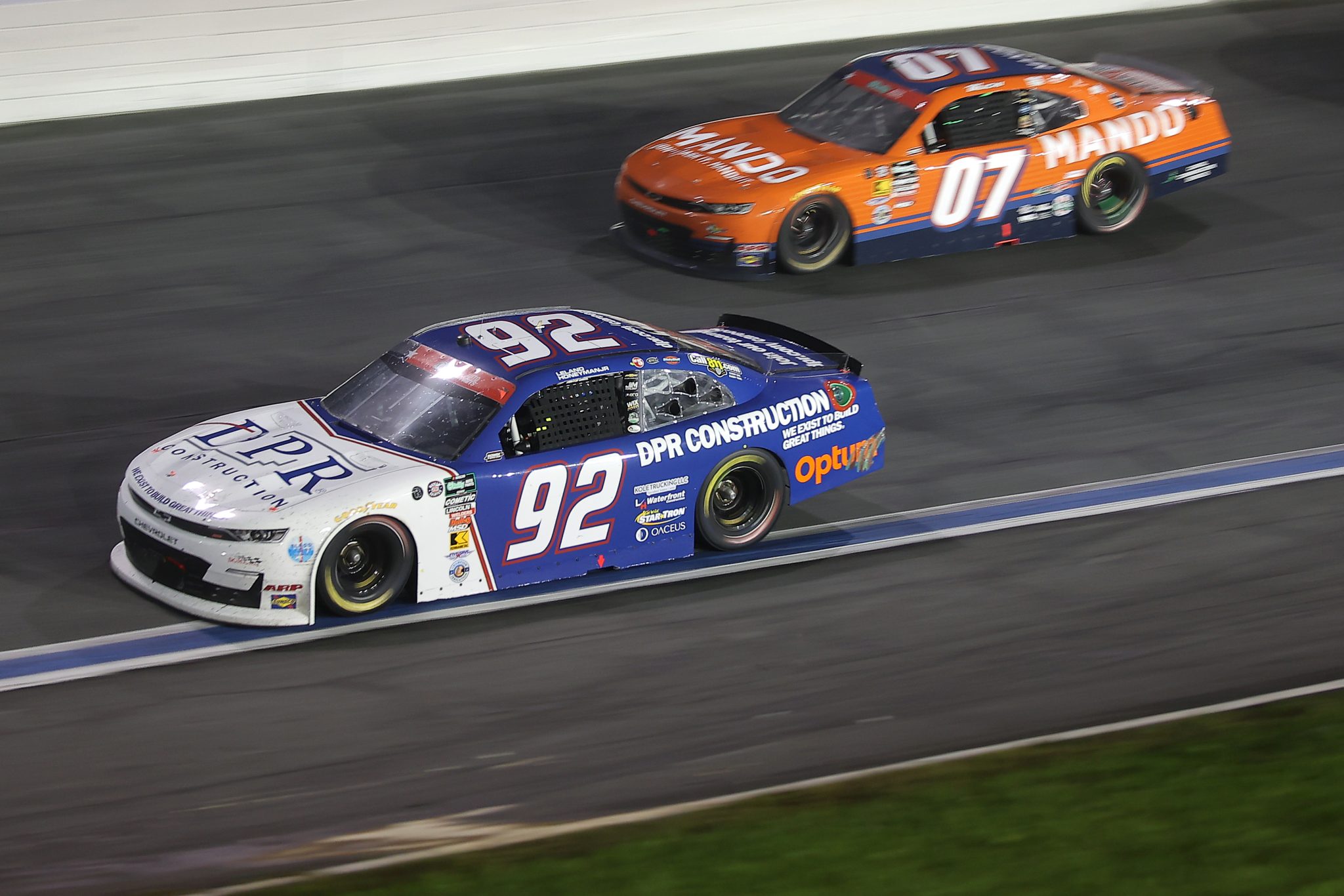 CONCORD, NORTH CAROLINA - MAY 23: Leland Honeyman Jr., driver of the #92 DPR Construction Chevrolet, Josh Bilicki, driver of the #07 Mando Chevrolet, race during the NASCAR O'Reilly Auto Parts Series Charbroil 300 at Charlotte Motor Speedway on May 23, 2026 in Concord, North Carolina. (Photo by Jonathan Bachman/Getty Images) | Getty Images