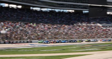 FORT WORTH, TEXAS - MAY 03: Carson Hocevar, driver of the #77 Spectrum Chevrolet, and Ty Gibbs, driver of the #54 Interstate Batteries Toyota, lead the field on a restart during the NASCAR Cup Series Würth 400 presented by LIQUI MOLY at Texas Motor Speedway on May 03, 2026 in Fort Worth, Texas. (Photo by James Gilbert/Getty Images) | Getty Images