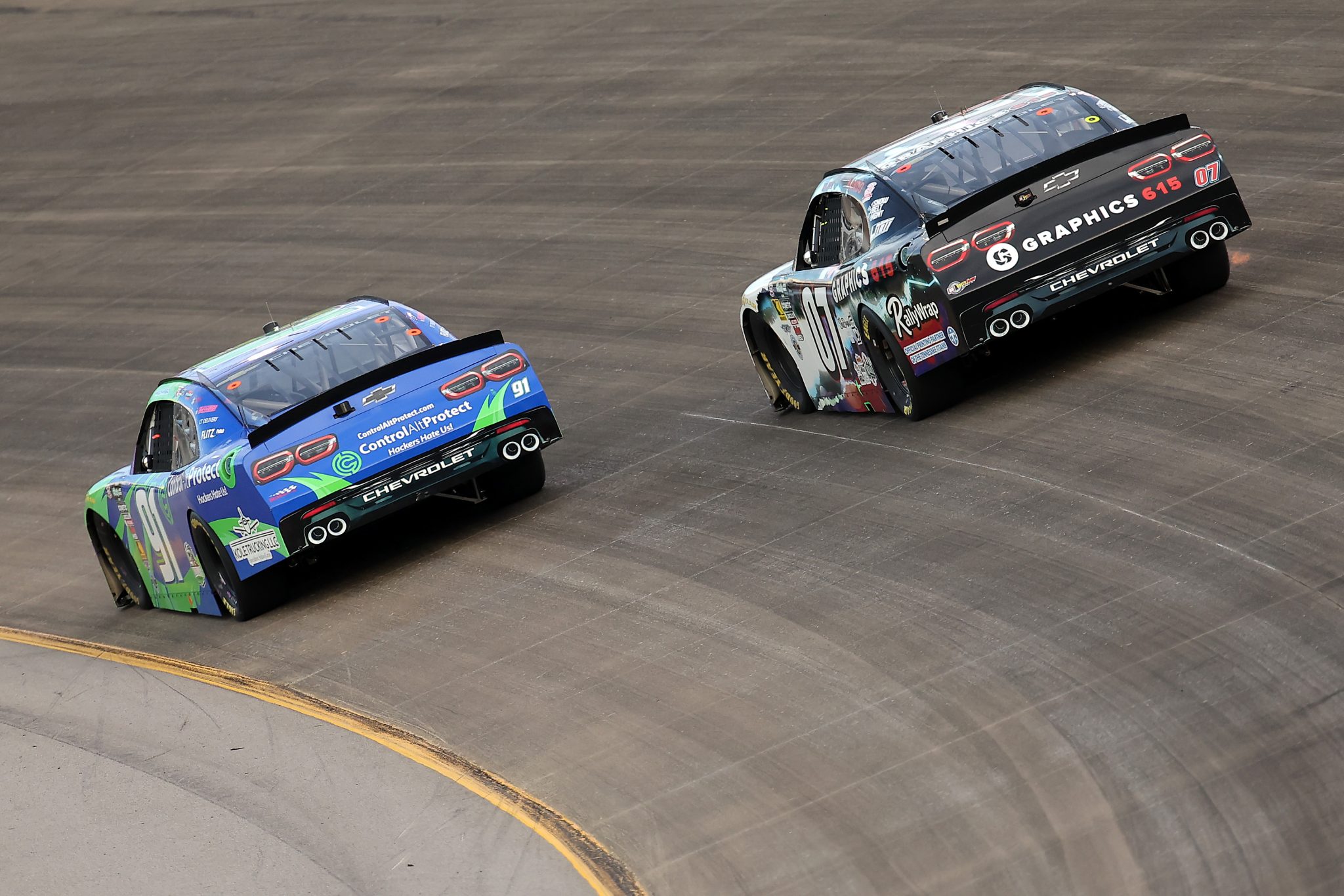 LEBANON, TENNESSEE - MAY 30: Mason Maggio, driver of the #91 ControlAltProtect Chevrolet, and Josh Bilicki, driver of the #02 Graphics 615 Chevrolet, race during the NASCAR O'Reilly Auto Parts Series Sports Illustrated Resorts 250 at Nashville Superspeedway on May 30, 2026 in Lebanon, Tennessee. (Photo by Jonathan Bachman/Getty Images) | Getty Images