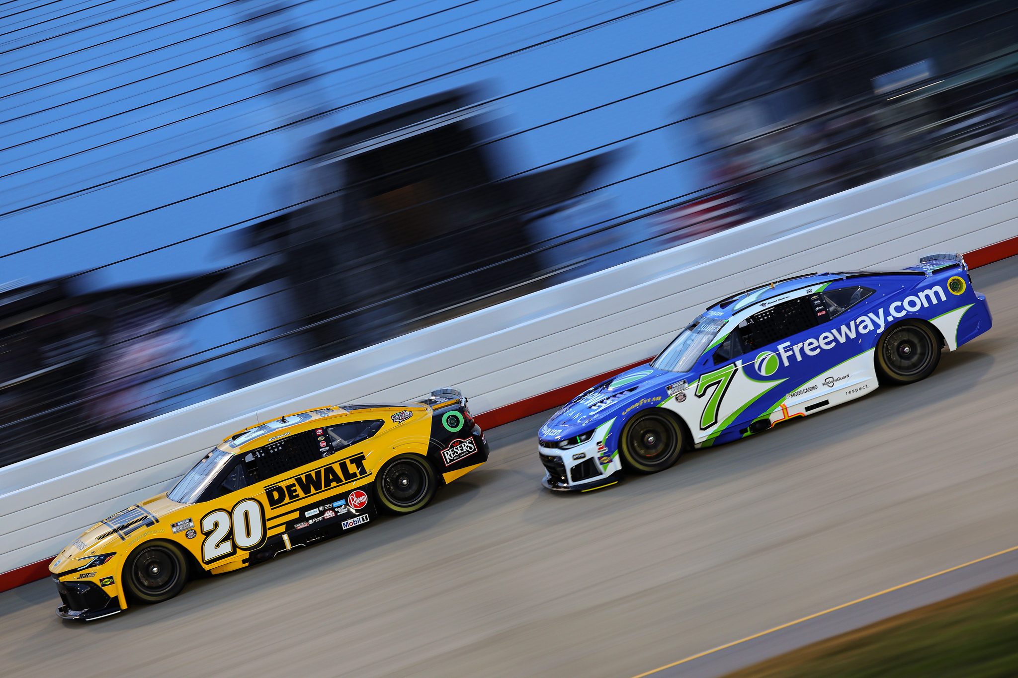 LEBANON, TENNESSEE - MAY 31: Christopher Bell, driver of the #20 DeWalt Toyota, and Daniel Suarez, driver of the #7 Freeway Insurance Chevrolet, race during the NASCAR Cup Series Cracker Barrel 400 at Nashville Superspeedway on May 31, 2026 in Lebanon, Tennessee. (Photo by Jonathan Bachman/Getty Images) | Getty Images