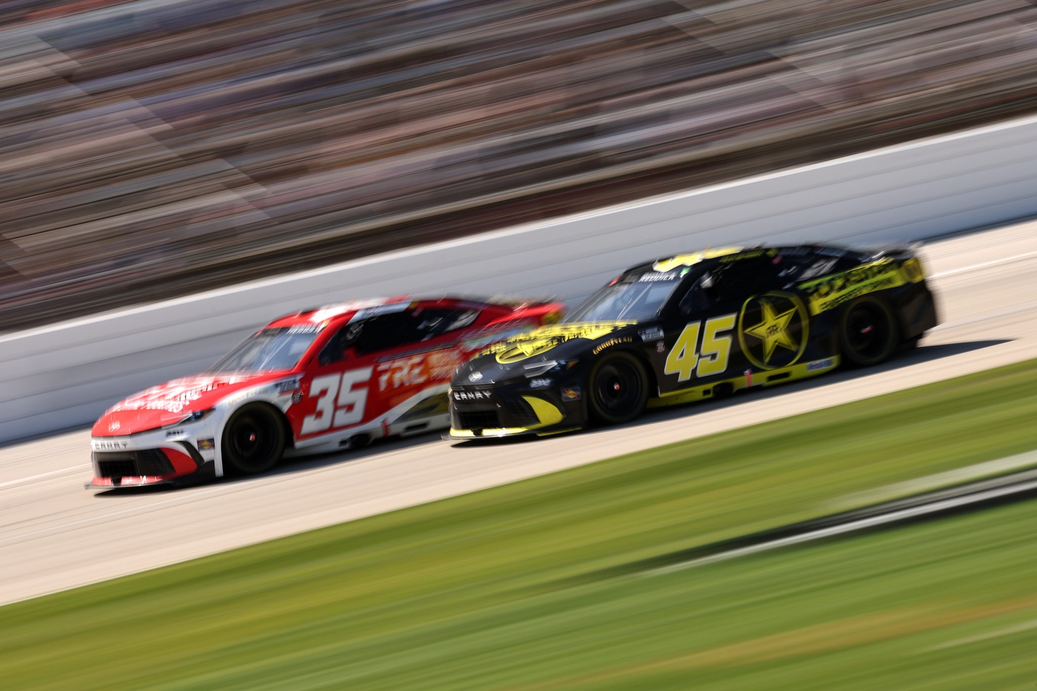 FORT WORTH, TEXAS - MAY 03: Riley Herbst, driver of the #35 FRE Nicotine Pouches Toyota, and Tyler Reddick, driver of the #45 ROCKSTAR ENERGY DRINK Toyota, race during the NASCAR Cup Series Würth 400 presented by LIQUI MOLY at Texas Motor Speedway on May 03, 2026 in Fort Worth, Texas. (Photo by James Gilbert/Getty Images) | Getty Images