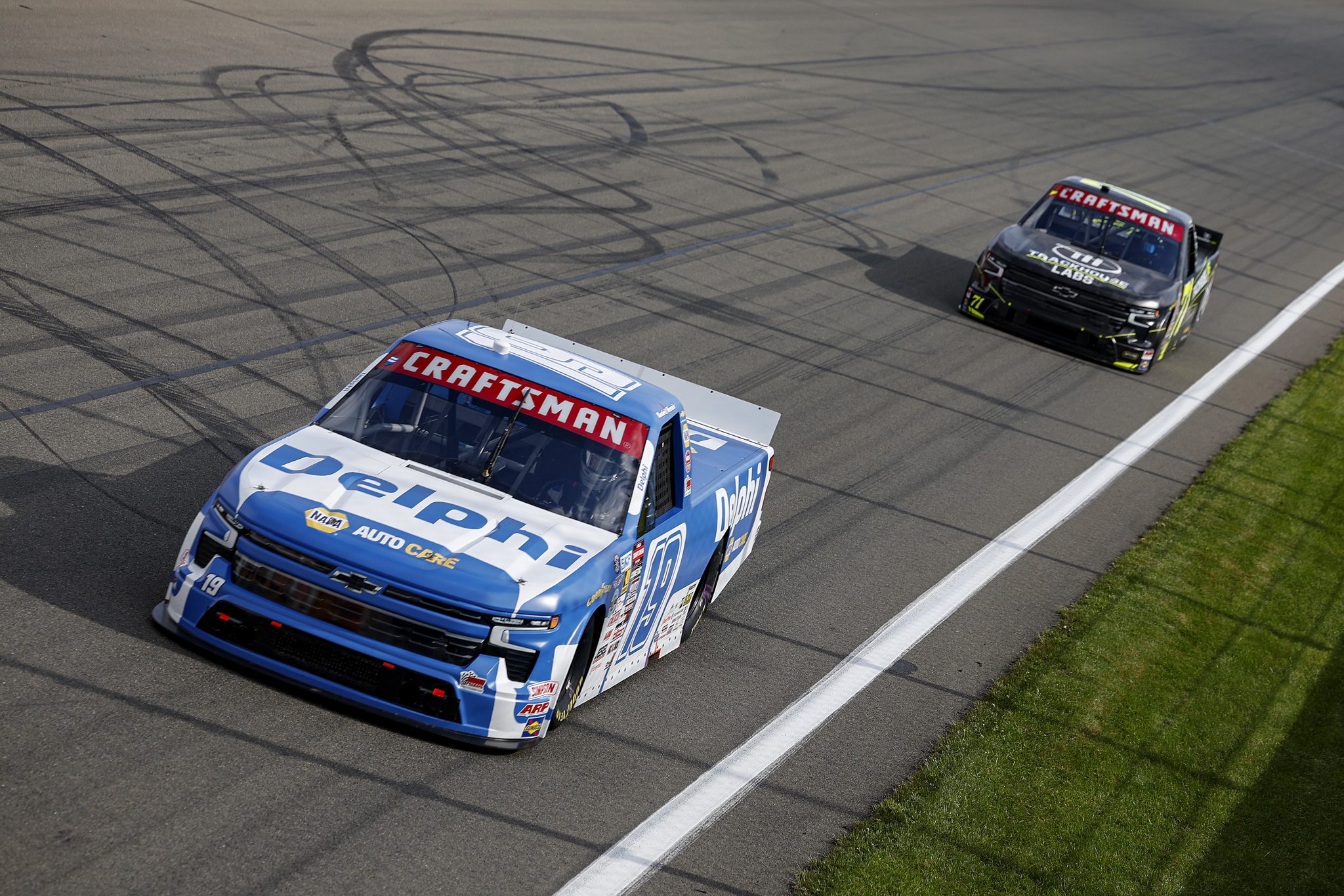WATKINS GLEN, NEW YORK - MAY 08: Daniel Hemric, driver of the #19 Delphi Chevrolet, and Connor Zilisch, driver of the #71 Trackhouse Labs Chevrolet, race during the NASCAR Craftsman Truck Series Bully Hill Vineyards 176 at The Glen at Watkins Glen International on May 08, 2026 in Watkins Glen, New York. (Photo by Sean Gardner/Getty Images) | Getty Images