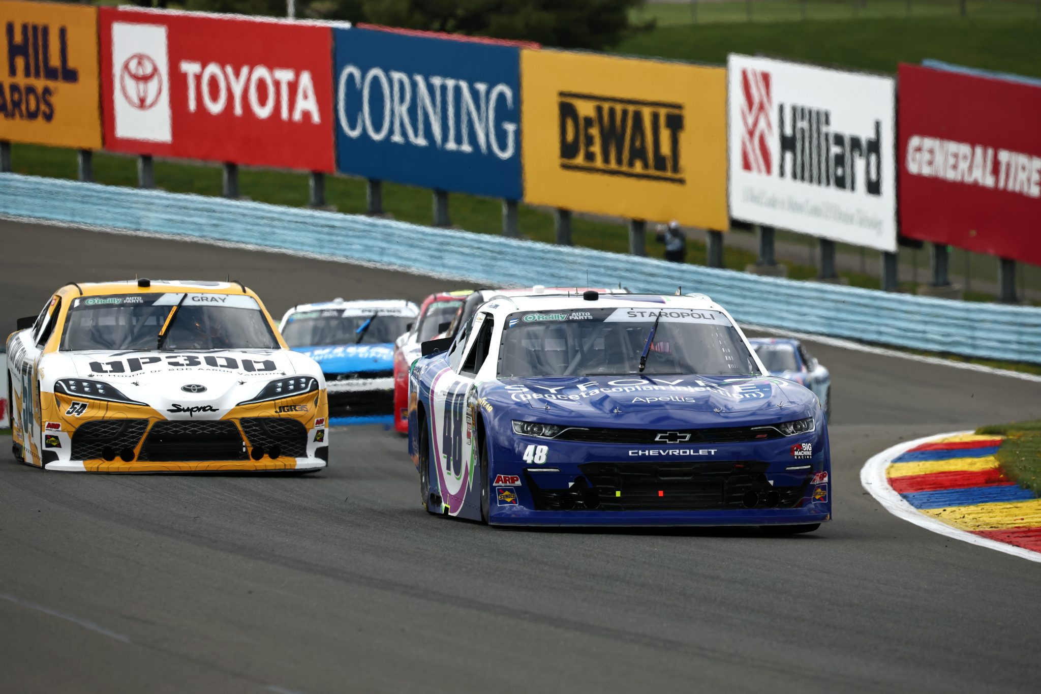 WATKINS GLEN, NEW YORK - MAY 09: Patrick Staropoli, driver of the #48 Syfovre Chevrolet, and Taylor Gray, driver of the #54 Operation 300 Toyota, race during the NASCAR O'Reilly Auto Parts Series Mission 200 at The Glen at Watkins Glen International on May 09, 2026 in Watkins Glen, New York. (Photo by Chris Graythen/Getty Images) | Getty Images
