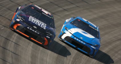 DOVER, DELAWARE - MAY 17: Tyler Reddick, driver of the #45 ACM Awards/Pinnacle Toyota, and Denny Hamlin, driver of the #11 Progressive Insurance Toyota, race during the NASCAR Cup Series All-Star Race at Dover Motor Speedway on May 17, 2026 in Dover, Delaware. (Photo by Meg Oliphant/Getty Images) | Getty Images
