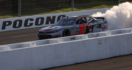 LONG POND, PENNSYLVANIA - JUNE 13: Justin Allgaier, driver of the #7 Carolina Carports Chevrolet, celebrates with a burnout after winning the NASCAR O'Reilly Auto Parts Series MillerTech Battery 250 presented by KOA at Pocono Raceway on June 13, 2026 in Long Pond, Pennsylvania. (Photo by James Gilbert/Getty Images) | Getty Images