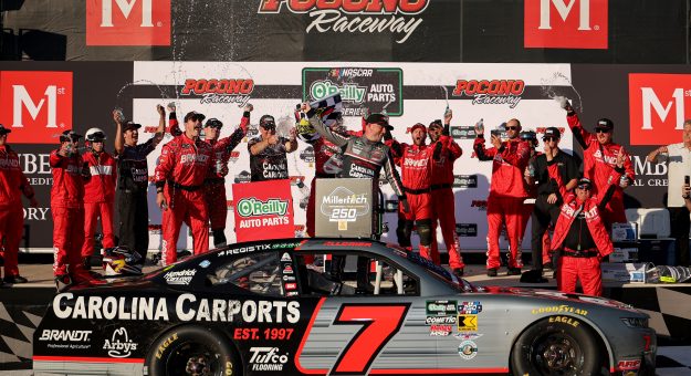LONG POND, PENNSYLVANIA - JUNE 13: Justin Allgaier, driver of the #7 Carolina Carports Chevrolet, celebrates in victory lane after winning the NASCAR O'Reilly Auto Parts Series MillerTech Battery 250 presented by KOA at Pocono Raceway on June 13, 2026 in Long Pond, Pennsylvania. (Photo by James Gilbert/Getty Images) | Getty Images