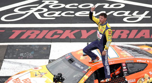 LONG POND, PENNSYLVANIA - JUNE 14: Denny Hamlin, driver of the #11 King's Hawaiian Shake 'Em Bites Toyota, celebrates after winning the NASCAR Cup Series Great American Getaway 400 presented by VISITPA at Pocono Raceway on June 14, 2026 in Long Pond, Pennsylvania. (Photo by James Gilbert/Getty Images) | Getty Images