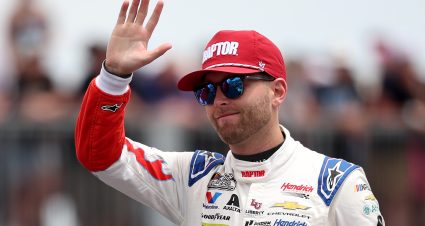 LONG POND, PENNSYLVANIA - JUNE 14: William Byron, driver of the #24 Raptor Chevrolet, waves to fans as he walks onstage during driver intros prior to the NASCAR Cup Series Great American Getaway 400 presented by VISITPA at Pocono Raceway on June 14, 2026 in Long Pond, Pennsylvania. (Photo by James Gilbert/Getty Images) | Getty Images