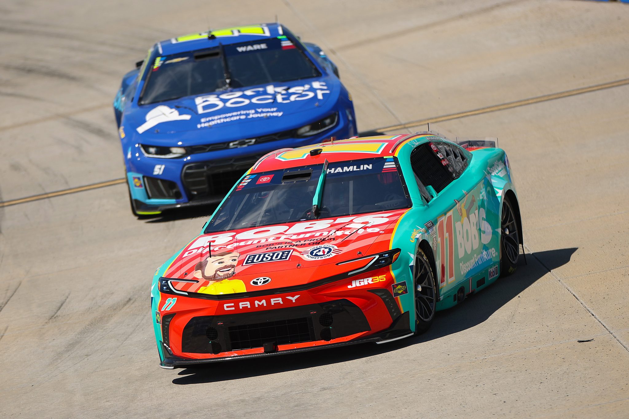 SAN DIEGO, CALIFORNIA - JUNE 19: Denny Hamlin, driver of the #11 Bob's Discount Furniture Toyota, and Cody Ware, driver of the #51 Rocket Doctor Chevrolet, drive during practice for the NASCAR Cup Series Anduril 250 at Naval Base Coronado on June 19, 2026 in San Diego, California. (Photo by James Gilbert/Getty Images) | Getty Images