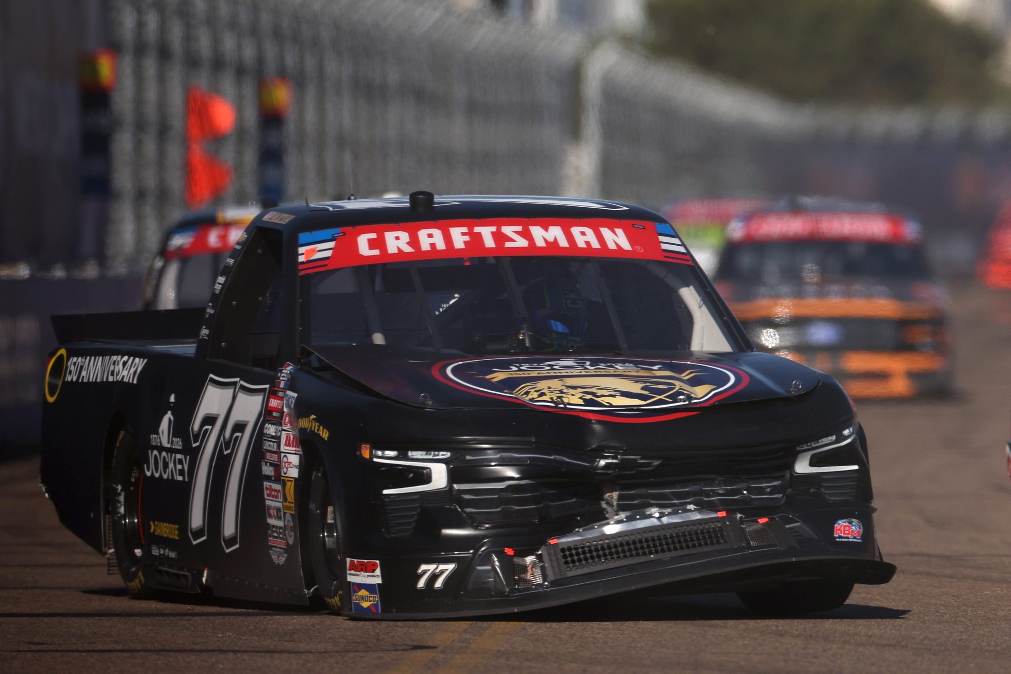 SAN DIEGO, CALIFORNIA - JUNE 19: Justin Marks, driver of the #77 Jockey 150th Anniversary Chevrolet, drives a damaged truck during the NASCAR Craftsman Truck Series Navy 250 at Naval Base Coronado on June 19, 2026 in San Diego, California. (Photo by James Gilbert/Getty Images) | Getty Images