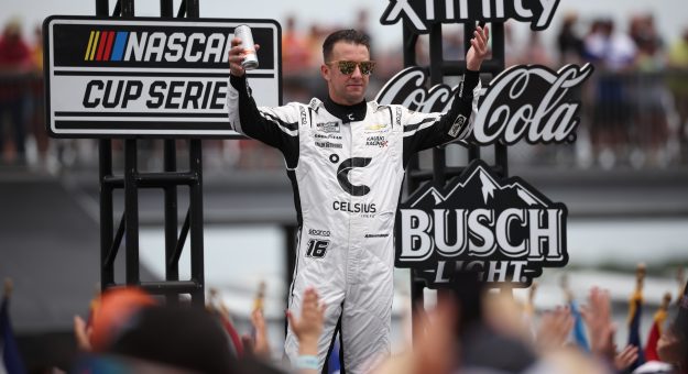 LONG POND, PENNSYLVANIA - JUNE 14: AJ Allmendinger, driver of the #16 Celsius Chevrolet, walks onstage during driver intros prior to the NASCAR Cup Series Great American Getaway 400 presented by VISITPA at Pocono Raceway on June 14, 2026 in Long Pond, Pennsylvania. (Photo by James Gilbert/Getty Images) | Getty Images