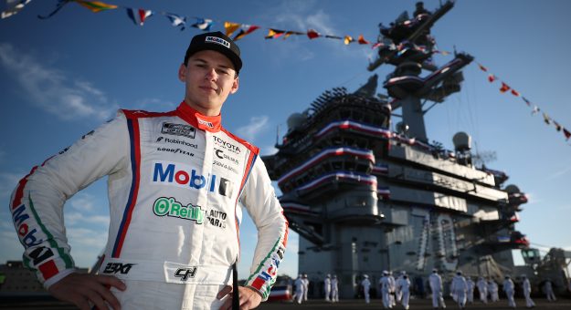 SAN DIEGO, CALIFORNIA - JUNE 21: Corey Heim, driver of the #67 Mobil 1/O'Reilly Auto Parts Toyota, poses for a photo on the deck of the The USS Carl Vinson (CVN-70) after winning the NASCAR Cup Series Anduril 250 at Naval Base Coronado on June 21, 2026 in San Diego, California. (Photo by Chris Graythen/Getty Images) | Getty Images