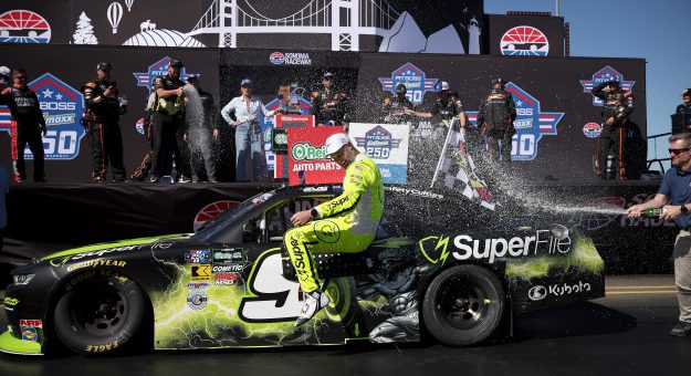 SONOMA, CALIFORNIA - JUNE 27: Shane Van Gisbergen, driver of the #9 SuperFile Chevrolet, is sprayed with champagne by NASCAR Hall of Famer and JR Motorsports team owner, Dale Earnhardt Jr. in victory lane after winning  the NASCAR O'Reilly Auto Parts Series Pit Boss/FoodMaxx 250 at Sonoma Raceway on June 27, 2026 in Sonoma, California. (Photo by James Gilbert/Getty Images) | Getty Images