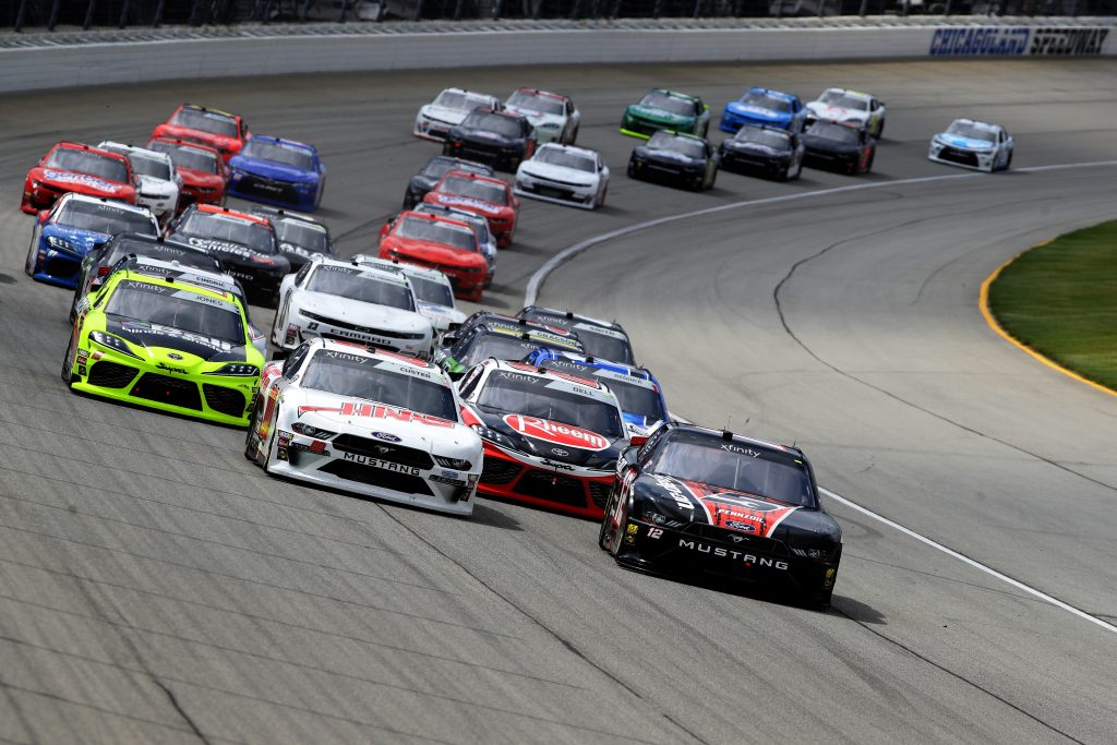 JOLIET, ILLINOIS - JUNE 29: Cole Custer, driver of the #00 Haas Automation Ford, and Joey Logano, driver of the #12 Snap On Ford, lead a pack of cars during the NASCAR Xfinity Series Camping World 300 at Chicagoland Speedway on June 29, 2019 in Joliet, Illinois. (Photo by Jonathan Daniel/Getty Images) | Getty Images
