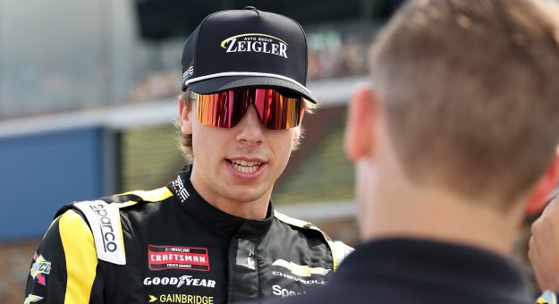 BROOKLYN, MICHIGAN - JUNE 06: Carson Hocevar, driver of the #77 Zeigler Auto Group Chevrolet, speaks to a crew member during qualifying for the NASCAR Craftsman Truck Series DQS Solutions & Staffing 250 presented by Precision Vehicle Logistics at Michigan International Speedway on June 06, 2026 in Brooklyn, Michigan. (Photo by Brett Farmer/Getty Images) | Getty Images