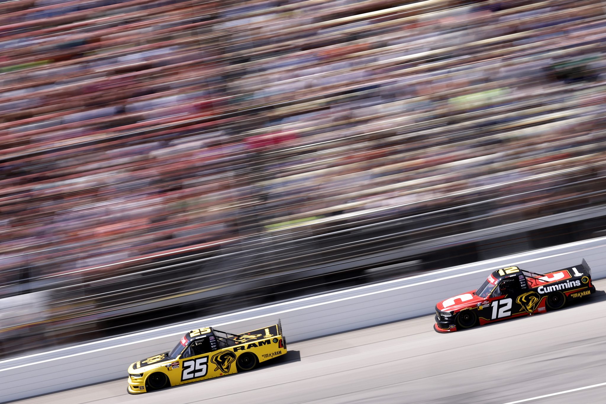 BROOKLYN, MICHIGAN - JUNE 06: Parker Kligerman, driver of the #25 Ram RAM, and Brenden Queen, driver of the #12 Cummins RAM, race during the NASCAR Craftsman Truck Series DQS Solutions & Staffing 250 presented by Precision Vehicle Logistics at Michigan International Speedway on June 06, 2026 in Brooklyn, Michigan. (Photo by Sean Gardner/Getty Images) | Getty Images