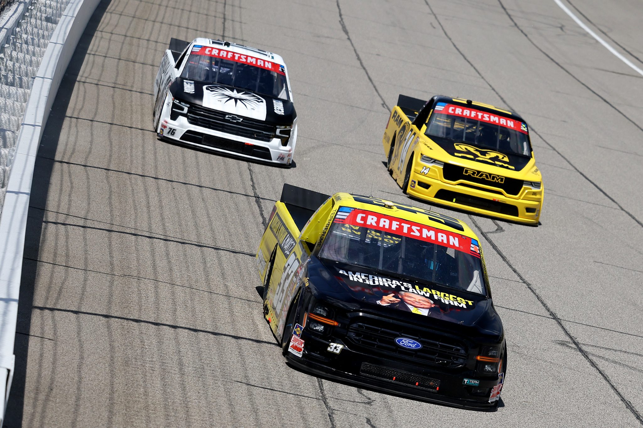 BROOKLYN, MICHIGAN - JUNE 06: Frankie Muniz, driver of the #33 Morgan & Morgan Ford, Mini Tyrrell, driver of the #14 Ram RAM, and Spencer Boyd, driver of the #76 Desnuda Organic Tequila Chevrolet, race during the NASCAR Craftsman Truck Series DQS Solutions & Staffing 250 presented by Precision Vehicle Logistics at Michigan International Speedway on June 06, 2026 in Brooklyn, Michigan. (Photo by Brett Farmer/Getty Images) | Getty Images