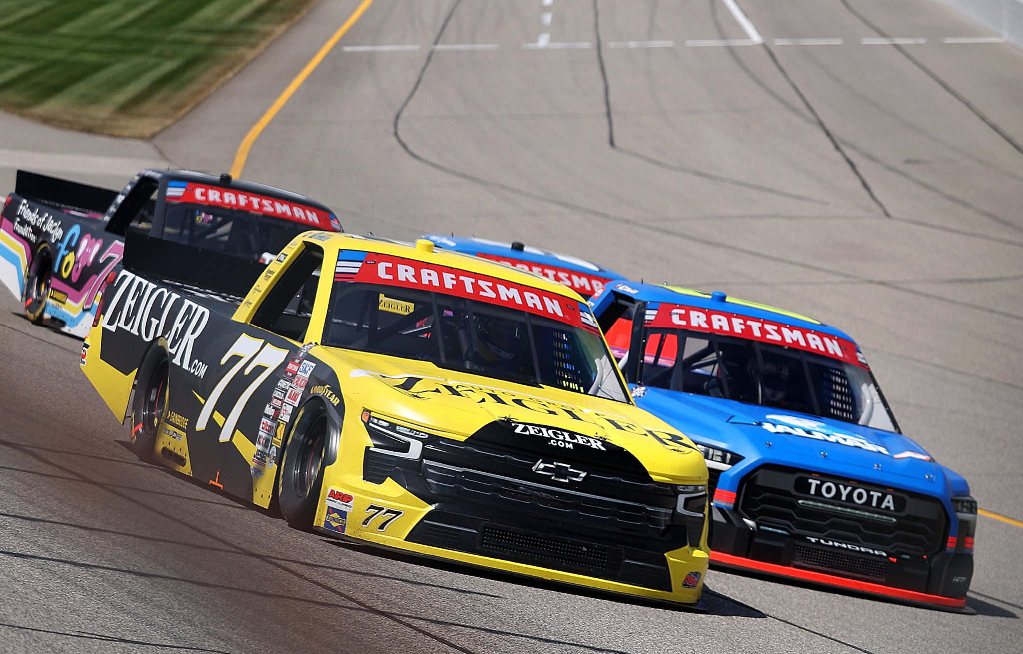 BROOKLYN, MICHIGAN - JUNE 06: Carson Hocevar, driver of the #77 Zeigler Auto Group Chevrolet, and Stewart Friesen, driver of the #52 Halmar International Toyota, race during the NASCAR Craftsman Truck Series DQS Solutions & Staffing 250 presented by Precision Vehicle Logistics at Michigan International Speedway on June 06, 2026 in Brooklyn, Michigan. (Photo by Brett Farmer/Getty Images) | Getty Images