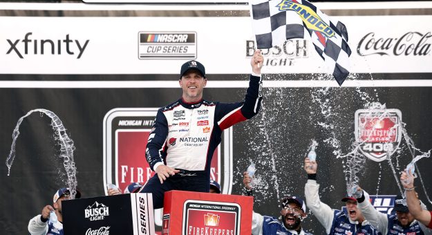 BROOKLYN, MICHIGAN - JUNE 07: Denny Hamlin, driver of the #11 National Debt Relief Toyota, celebrates in victory lane after winning the NASCAR Cup Series FireKeepers Casino 400 at Michigan International Speedway on June 07, 2026 in Brooklyn, Michigan. (Photo by Sean Gardner/Getty Images) | Getty Images