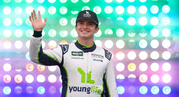 CONCORD, NORTH CAROLINA - MAY 23: Brent Crews, driver of the #19 YoungLife Toyota, waves to fans as he walks onstage during driver intros prior to the NASCAR O'Reilly Auto Parts Series Charbroil 300 at Charlotte Motor Speedway on May 23, 2026 in Concord, North Carolina. (Photo by David Jensen/Getty Images) | Getty Images