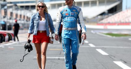 CONCORD, NORTH CAROLINA - MAY 24: Jeb Burton, driver of the #27 Timber Creek/Dive Bomb Chevrolet, and guest walk the grid during practice for the NASCAR Xfinity Series BetMGM 300 at Charlotte Motor Speedway on May 24, 2025 in Concord, North Carolina. (Photo by David Jensen/Getty Images) | Getty Images