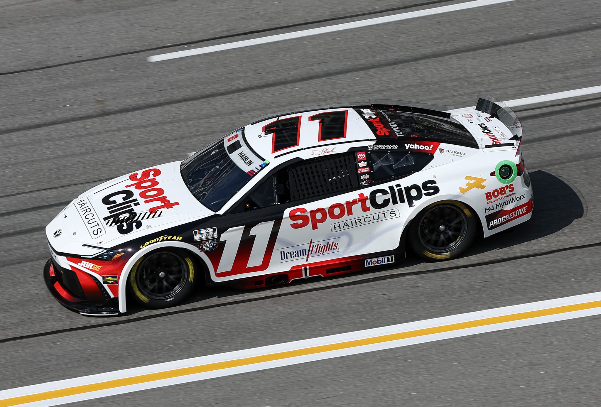 HAMPTON, GEORGIA - JULY 11: Denny Hamlin, driver of the #11 Sport Clips Haircuts Toyota, drives during qualifying for the NASCAR Cup Series Quaker State 400 Available at Walmart at EchoPark Speedway on July 11, 2026 in Hampton, Georgia. (Photo by Meg Oliphant/Getty Images) | Getty Images