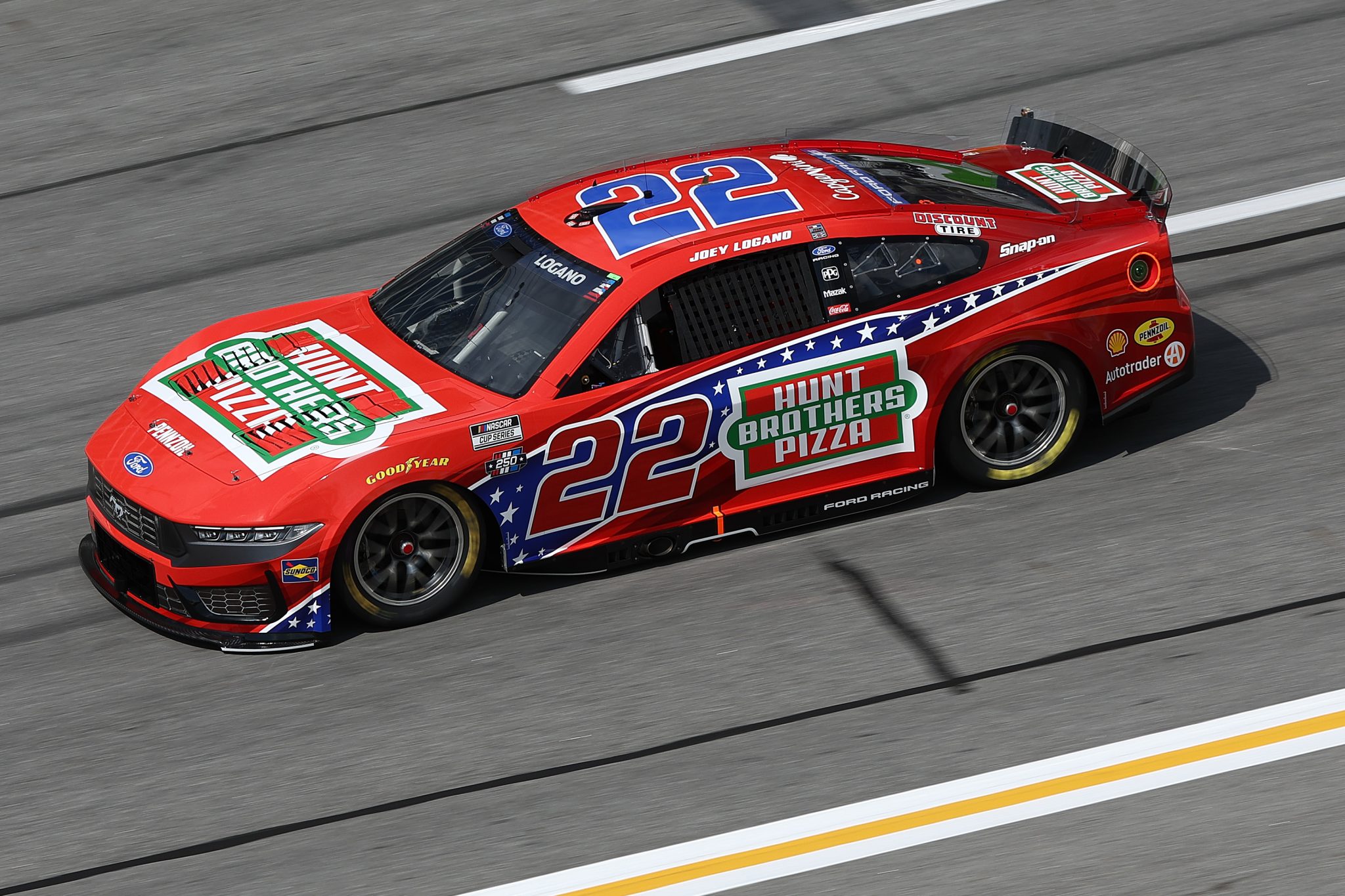 HAMPTON, GEORGIA - JULY 11: Joey Logano, driver of the #22 Hunt Brothers Pizza Ford, drives during qualifying for the NASCAR Cup Series Quaker State 400 Available at Walmart at EchoPark Speedway on July 11, 2026 in Hampton, Georgia. (Photo by Meg Oliphant/Getty Images) | Getty Images