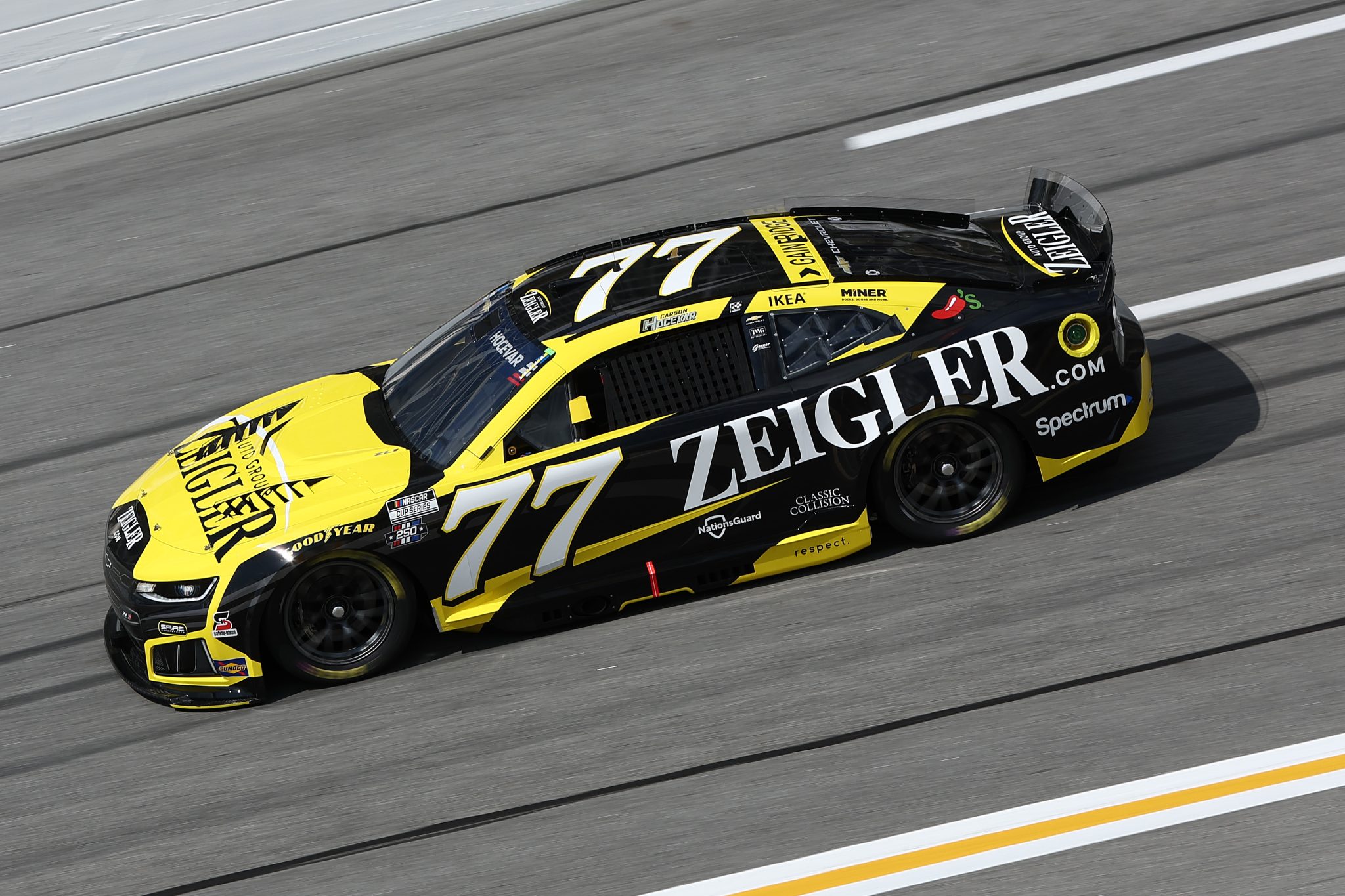 HAMPTON, GEORGIA - JULY 11: Carson Hocevar, driver of the #77 Zeigler Auto Group Chevrolet, drives during qualifying for the NASCAR Cup Series Quaker State 400 Available at Walmart at EchoPark Speedway on July 11, 2026 in Hampton, Georgia. (Photo by Meg Oliphant/Getty Images) | Getty Images