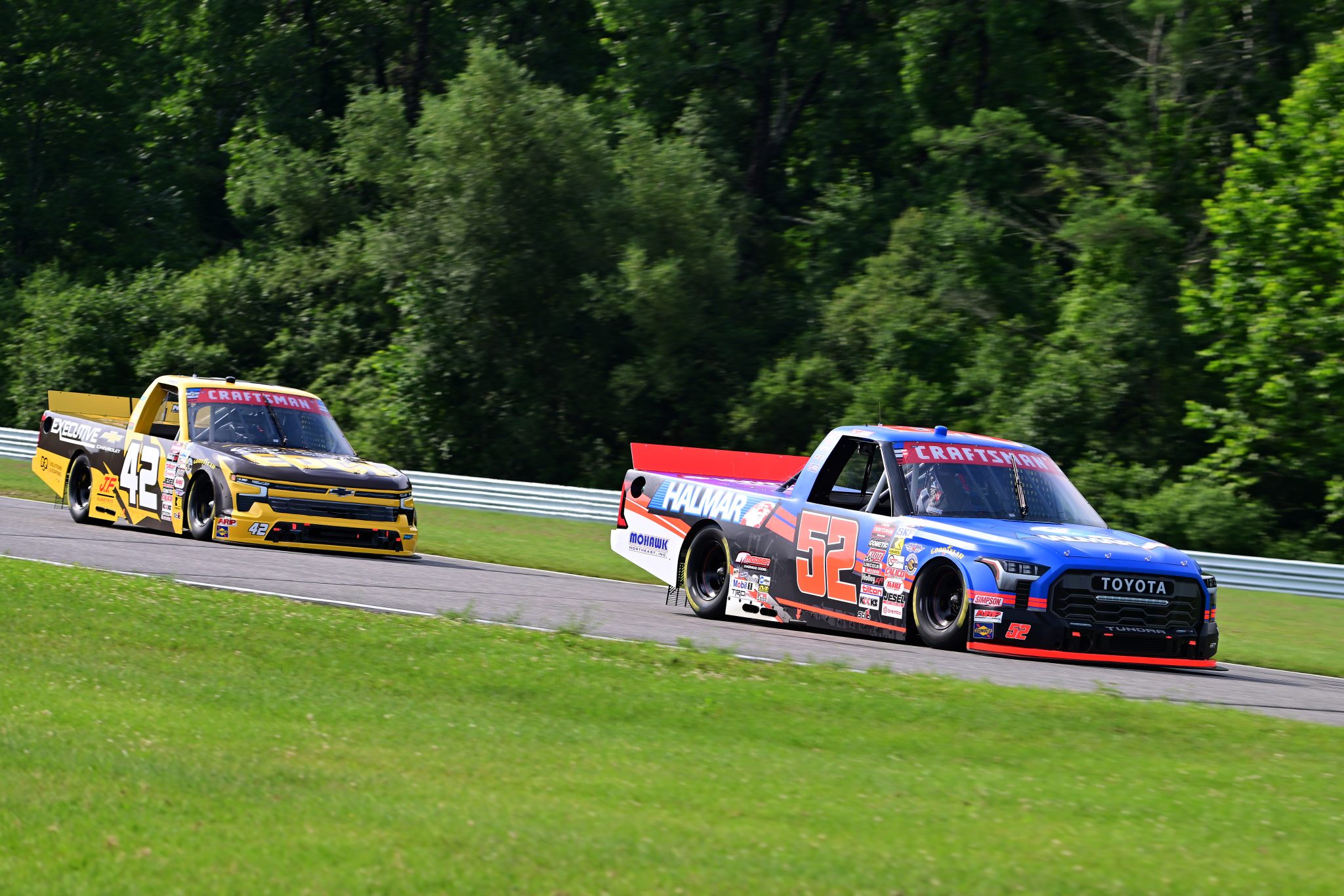 LAKEVILLE, CONNECTICUT - JULY 11: Stewart Friesen, driver of the #52 Halmar International Toyota, and Ben Maier, driver of the #42 Executive Chevrolet Chevrolet, drive during practice for the NASCAR Craftsman Truck Series LiUNA 150 at Lime Rock Park on July 11, 2026 in Lakeville, Connecticut. (Photo by Jaiden Tripi/Getty Images) | Getty Images