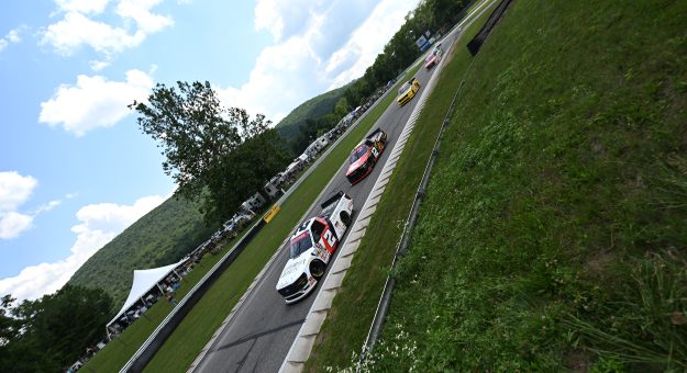 LAKEVILLE, CONNECTICUT - JULY 11: Jackson Lee, driver of the #2 California Closets/Browning Chapman Ford, and Brenden Queen, driver of the #12 Cummins RAM, race during the NASCAR Craftsman Truck Series LiUNA 150 at Lime Rock Park on July 11, 2026 in Lakeville, Connecticut. (Photo by Jaiden Tripi/Getty Images) | Getty Images