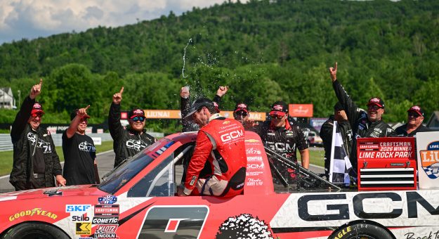 LAKEVILLE, CONNECTICUT - JULY 11: Grant Enfinger, driver of the #9 Grant County Mulch Chevrolet, and crew celebrate after winning the NASCAR Craftsman Truck Series LiUNA 150 at Lime Rock Park on July 11, 2026 in Lakeville, Connecticut. (Photo by Jaiden Tripi/Getty Images) | Getty Images