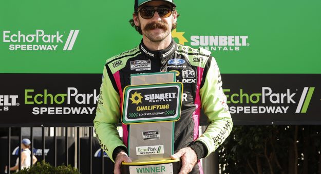 HAMPTON, GEORGIA - JULY 11: Ryan Blaney, driver of the #12 BODYARMOR FLASH I.V. Ford, poses for photos after winning the pole award during qualifying for the NASCAR Cup Series Quaker State 400 Available at Walmart at EchoPark Speedway on July 11, 2026 in Hampton, Georgia. (Photo by Sean Gardner/Getty Images) | Getty Images