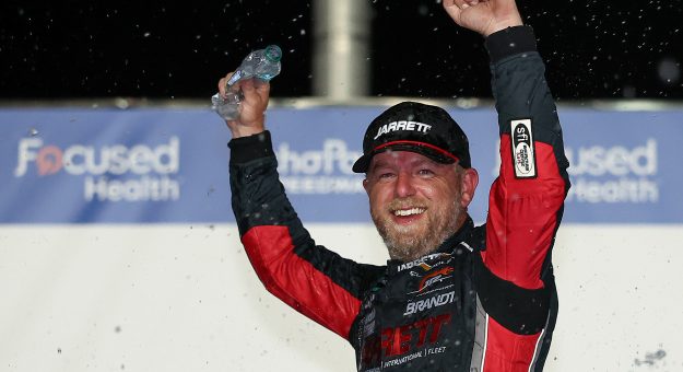 HAMPTON, GEORGIA - JULY 11: Justin Allgaier, driver of the #7 Jarrett Logistics Chevrolet, celebrates in victory lane after winning the NASCAR O'Reilly Auto Parts Series Focused Health 250 at EchoPark Speedway on July 11, 2026 in Hampton, Georgia. (Photo by Meg Oliphant/Getty Images) | Getty Images