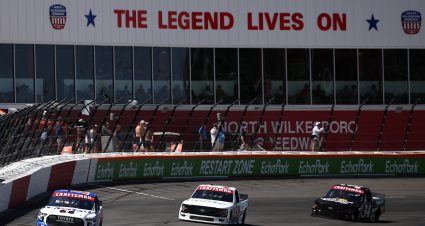 NORTH WILKESBORO, NORTH CAROLINA - MAY 17: Corey Heim, driver of the #11 Mobil 1 Toyota, Chandler Smth, driver of the #38 QuickTie Ford, and Layne Riggs, driver of the #34 UNC Charlotte Ford, race during the NASCAR Craftsman Truck Series Window World 250 at North Wilkesboro Speedway on May 17, 2025 in North Wilkesboro, North Carolina. (Photo by James Gilbert/Getty Images) | Getty Images