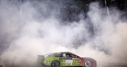 HAMPTON, GEORGIA - JULY 12: Ryan Blaney, driver of the #12 BODYARMOR FLASH I.V. Ford, celebrates with a burnout after winning the NASCAR Cup Series Quaker State 400 Available at Walmart at EchoPark Speedway on July 12, 2026 in Hampton, Georgia. (Photo by Sean Gardner/Getty Images) | Getty Images