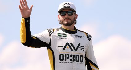 LONG POND, PENNSYLVANIA - JUNE 13: Taylor Gray, driver of the #54 Operation 300 Toyota, waves to fans as he walks onstage during driver intros prior to the NASCAR O'Reilly Auto Parts Series MillerTech Battery 250 presented by KOA at Pocono Raceway on June 13, 2026 in Long Pond, Pennsylvania. (Photo by David Jensen/Getty Images) | Getty Images