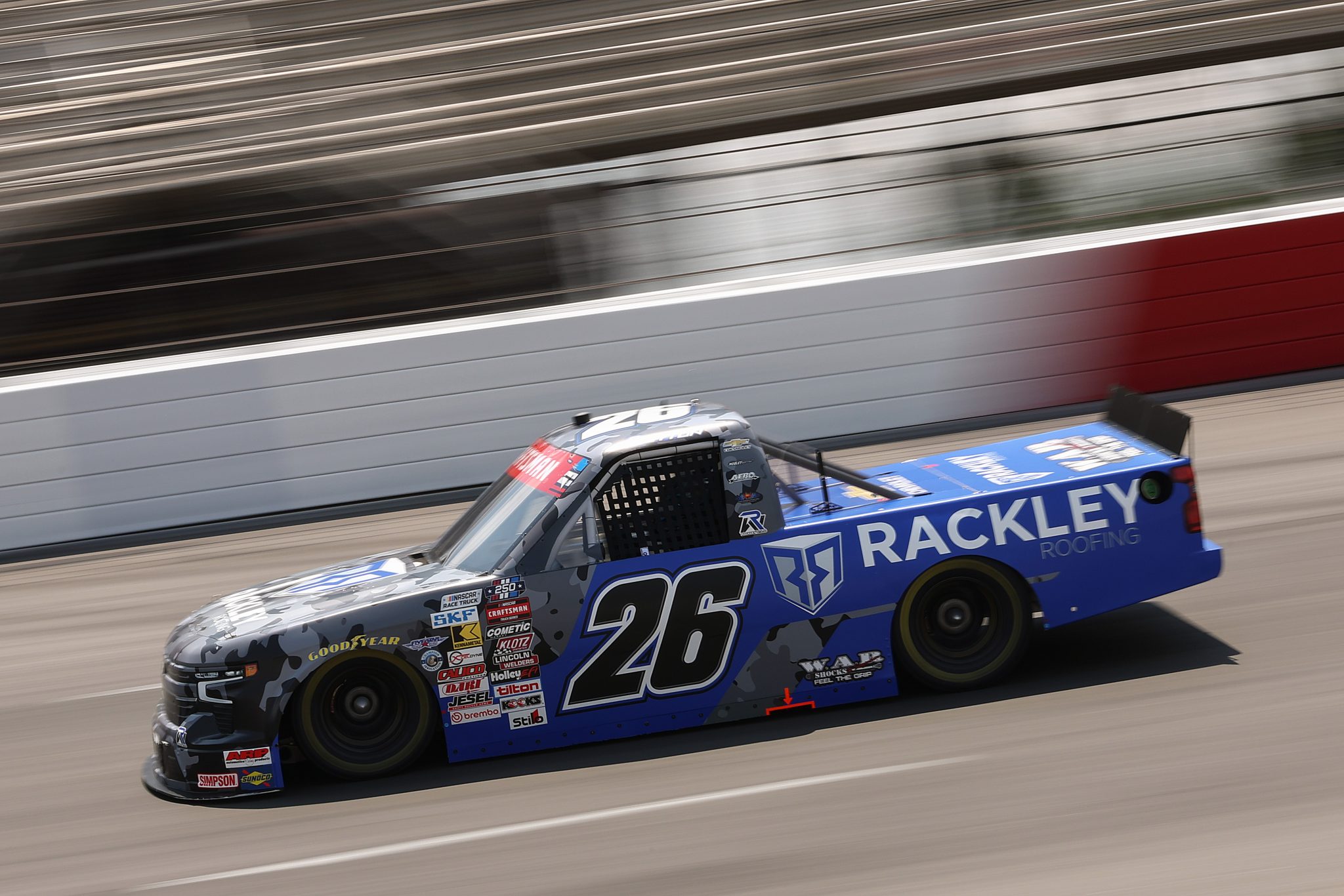 NORTH WILKESBORO, NORTH CAROLINA - JULY 17: Dawson Sutton, driver of the #26 Rackley Roofing Chevrolet, drives during practice for the NASCAR Craftsman Truck Series Faith Fest 250 at North Wilkesboro Speedway on July 17, 2026 in North Wilkesboro, North Carolina. (Photo by Meg Oliphant/Getty Images) | Getty Images