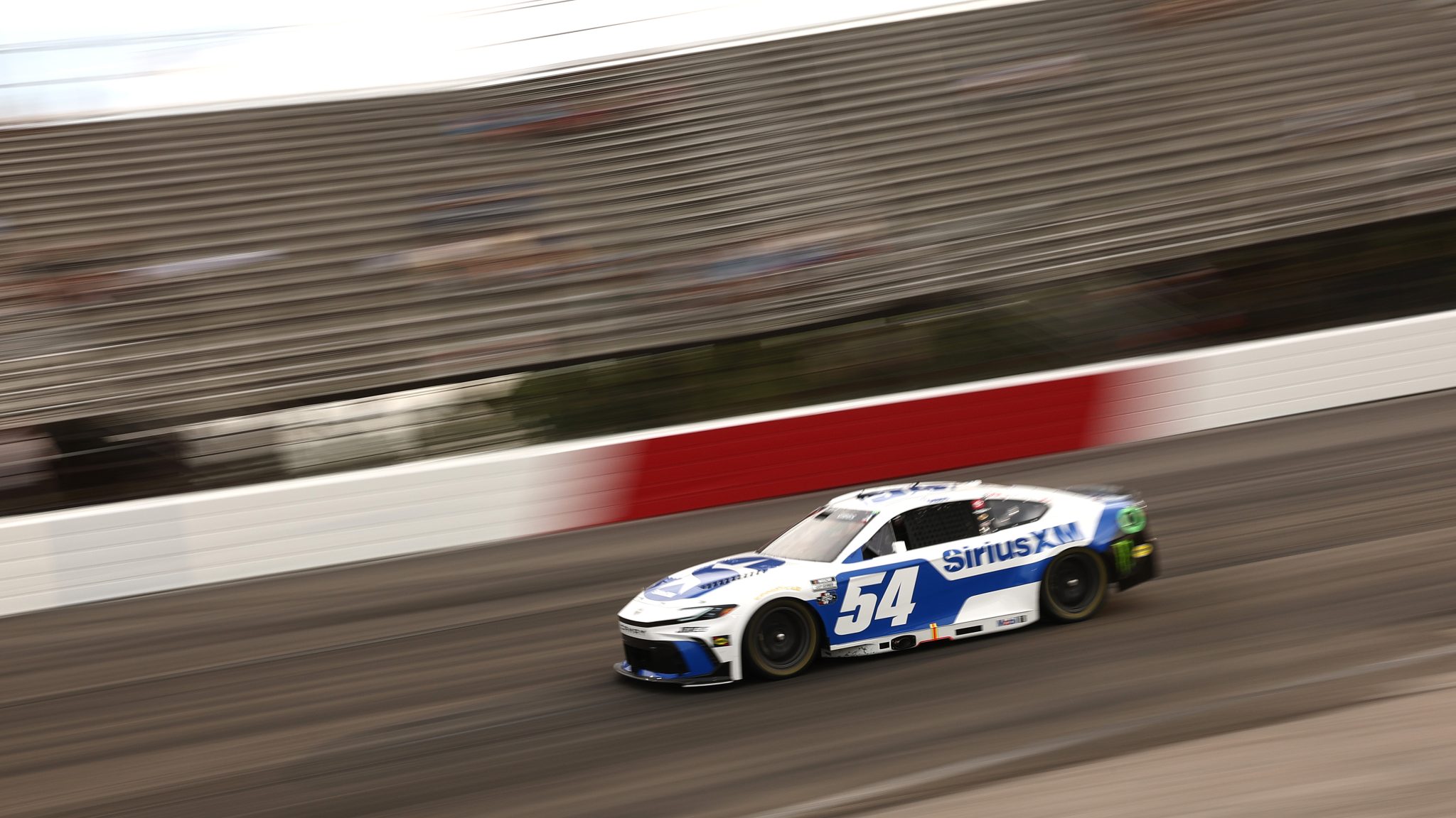 NORTH WILKESBORO, NORTH CAROLINA - JULY 18: Ty Gibbs, driver of the #54 SiriusXM Toyota, drives during practice for the NASCAR Cup Series Window World 450 at North Wilkesboro Speedway on July 18, 2026 in North Wilkesboro, North Carolina. (Photo by Meg Oliphant/Getty Images) | Getty Images