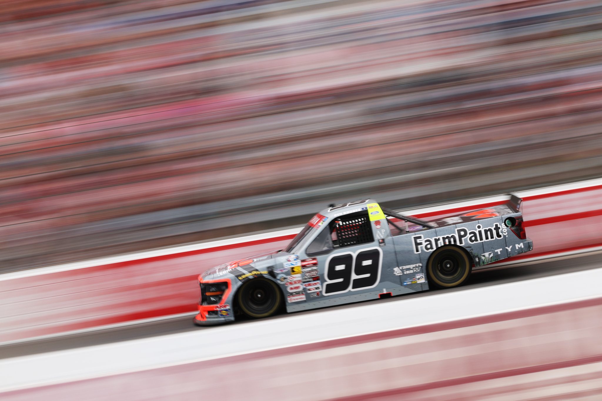 NORTH WILKESBORO, NORTH CAROLINA - JULY 18: Ben Rhodes, driver of the #99 Farm Paint Ford, drives during the NASCAR Craftsman Truck Series Faith Fest 250 at North Wilkesboro Speedway on July 18, 2026 in North Wilkesboro, North Carolina. (Photo by David Jensen/Getty Images) | Getty Images