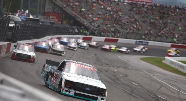 NORTH WILKESBORO, NORTH CAROLINA - JULY 18: Chandler Smith, driver of the #38 QuickTie Ford, leads the field during the NASCAR Craftsman Truck Series Faith Fest 250 at North Wilkesboro Speedway on July 18, 2026 in North Wilkesboro, North Carolina. (Photo by Meg Oliphant/Getty Images) | Getty Images