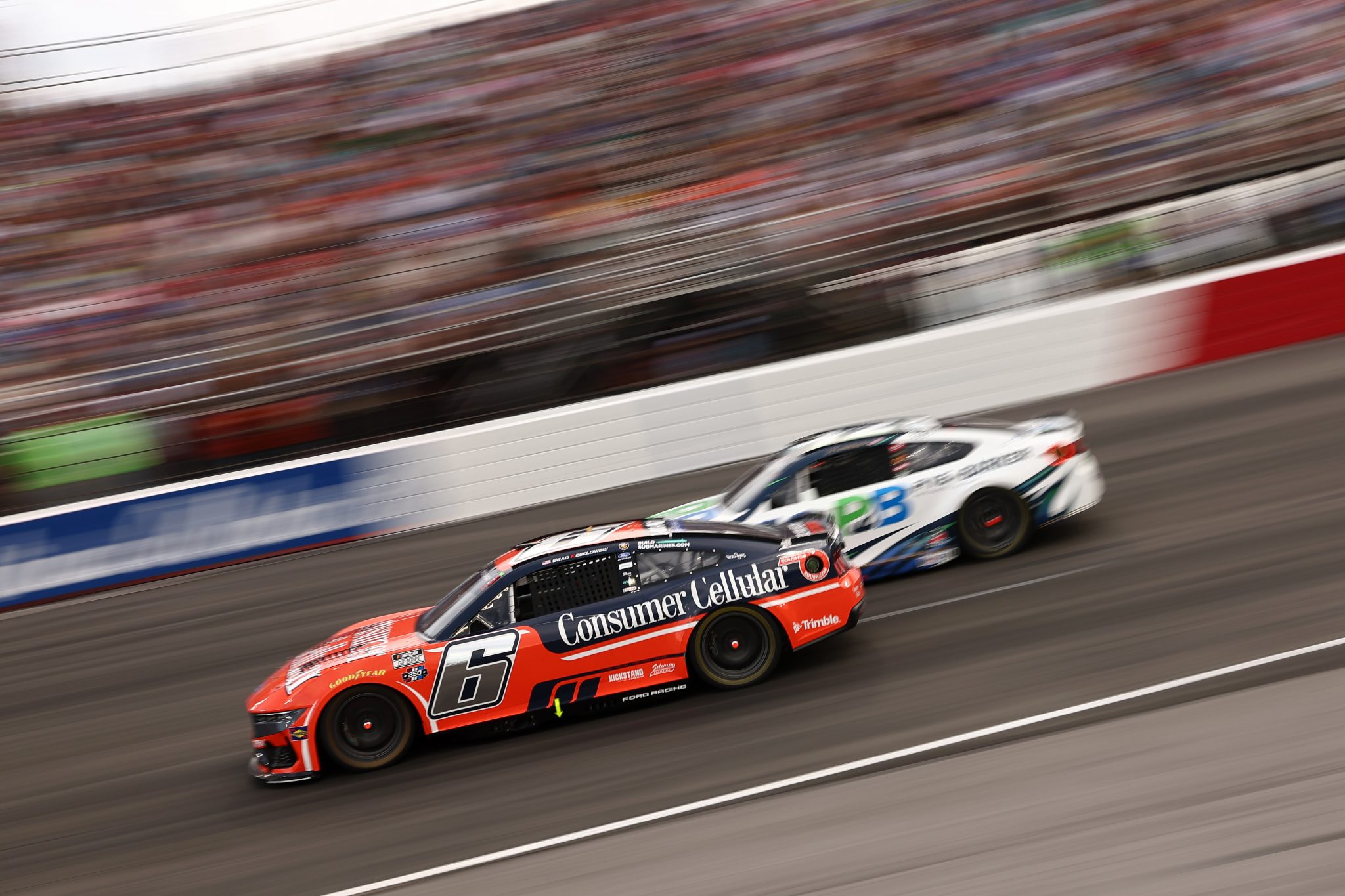 NORTH WILKESBORO, NORTH CAROLINA - JULY 19: Brad Keselowski, driver of the #6 Consumer Cellular Ford, and John Hunter Nemechek, driver of the #42 Pye-Barker Fire & Safety Toyota, race during the NASCAR Cup Series Window World 450 at North Wilkesboro Speedway on July 19, 2026 in North Wilkesboro, North Carolina. (Photo by Meg Oliphant/Getty Images) | Getty Images