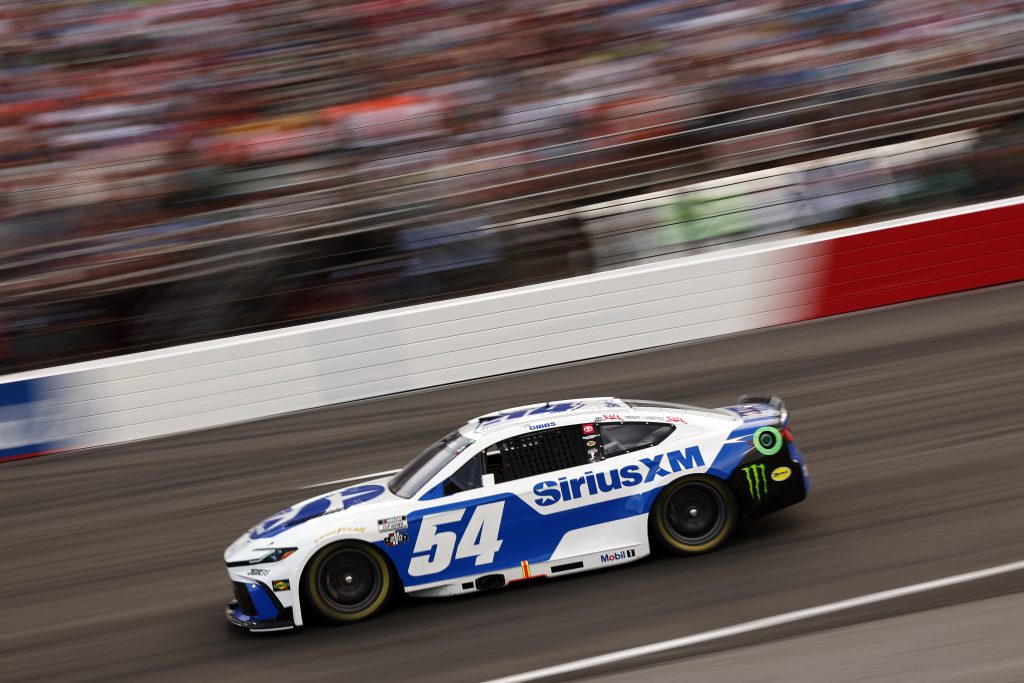 NORTH WILKESBORO, NORTH CAROLINA - JULY 19: Ty Gibbs, driver of the #54 SiriusXM Toyota, races during the NASCAR Cup Series Window World 450 at North Wilkesboro Speedway on July 19, 2026 in North Wilkesboro, North Carolina. (Photo by Meg Oliphant/Getty Images) | Getty Images